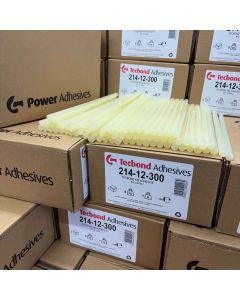 Multiple card board boxes containing 12mm Tecbond 214 packaging glue sticks with some sticks on show. They are pale amber in colour.